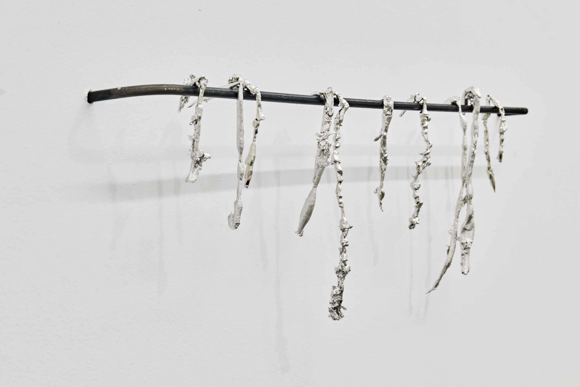 Luka Berchtold - <em>tears of tin (dry a.f.)</em>, 2021-2022, 16 × 60 × 5 cm, tin, steel (c) Miro Kuzmanovic